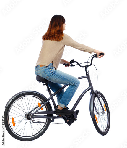 back view of a woman with a bicycle. cyclist sits on the bike. Rear view people collection. backside view of person. Isolated over white background. Girl in jacket learning to ride a bike.