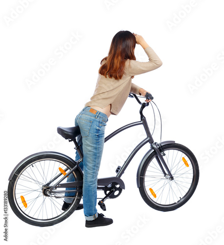 back side view of a woman with a bicycle. cyclist sits on the bike. Rear view people collection. backside view of person. Isolated over white background. 