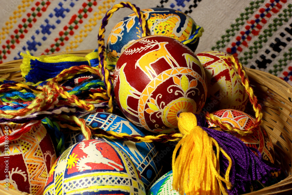 Handmade colored Easter eggs on traditional Ukrainian cloth background