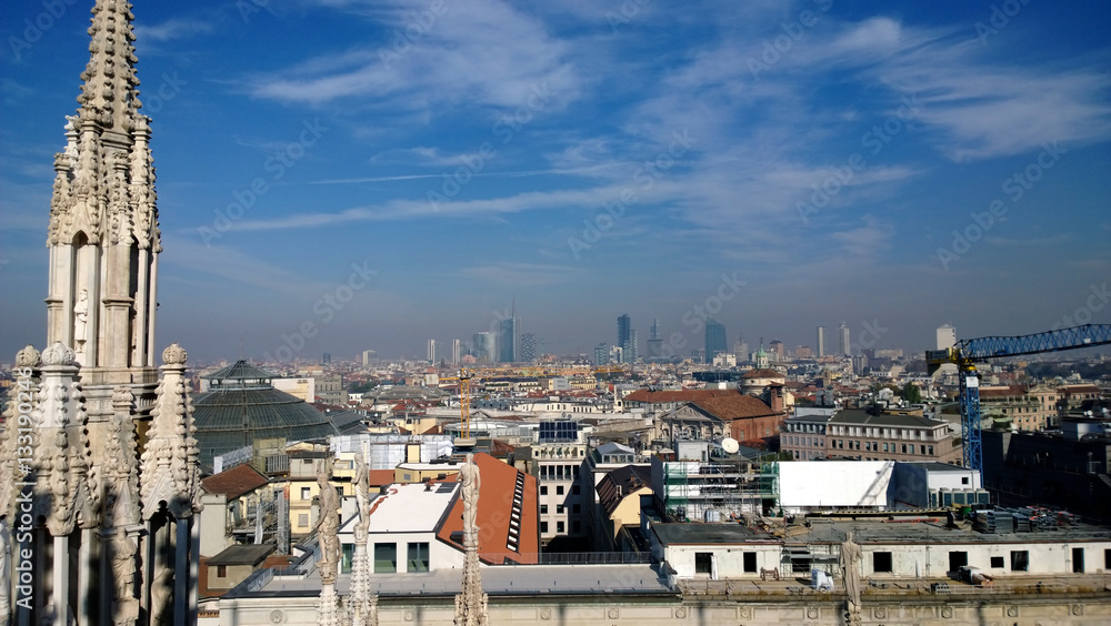 The view from the top of Milan Cathedral Duomo in a modern city. The smog over the city