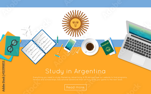 Study in Argentina concept for your web banner or print materials. Top view of a laptop, books and coffee cup on national flag. Flat style study abroad website header.