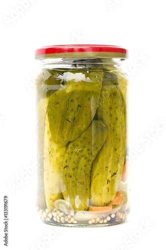  homemade marinated cucumbers in a glass