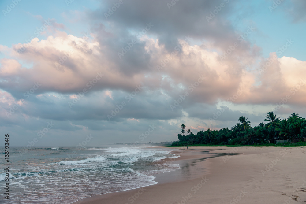 Sunny beach near Koggala - Sri Lanka. Waves of clear water and warm sand Sunny beach near Koggala - Sri Lanka. Waves of clear water and warm sand