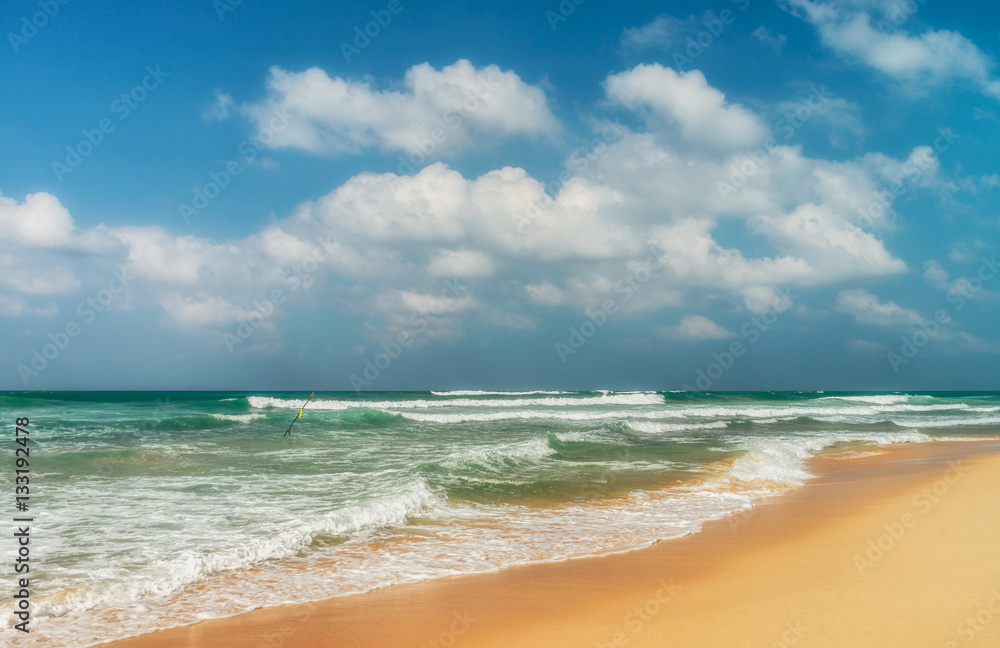 Sunny beach near Koggala - Sri Lanka. Waves of clear water and warm sand Sunny beach near Koggala - Sri Lanka. Waves of clear water and warm sand