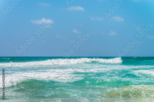 Fototapeta Naklejka Na Ścianę i Meble -  Sunny beach near Koggala - Sri Lanka. Waves of clear water and warm sand 