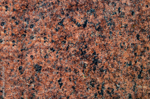 Natural stone granite background with bright hard rock texture
