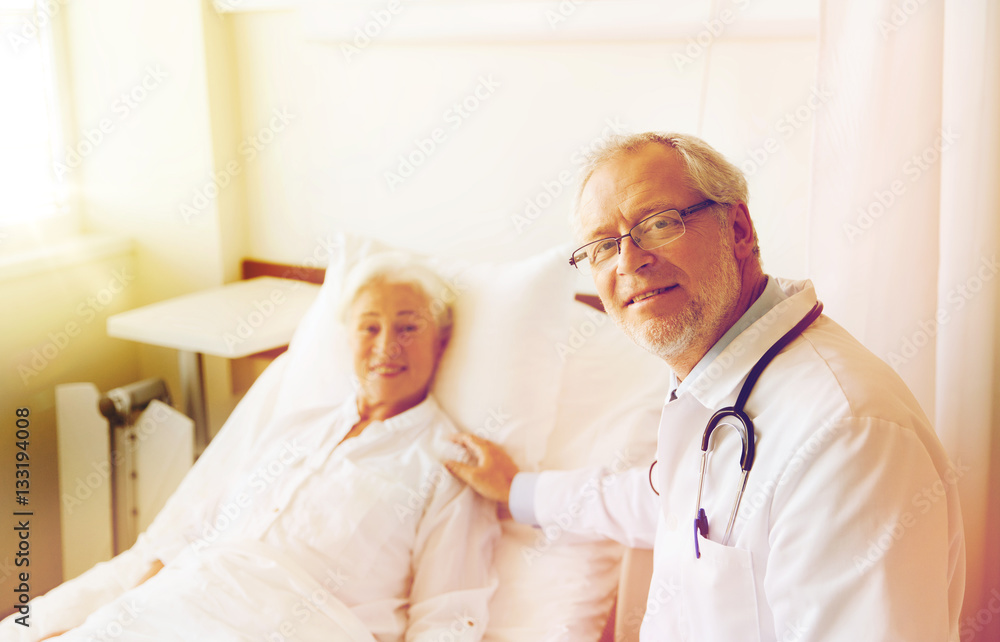 Fototapeta premium doctor visiting senior woman at hospital ward