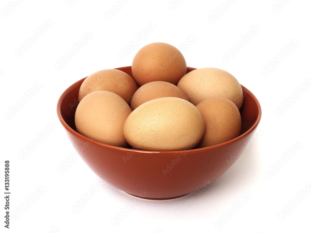 fresh eggs in a bowl on a white background fresh eggs in a bowl on a white background