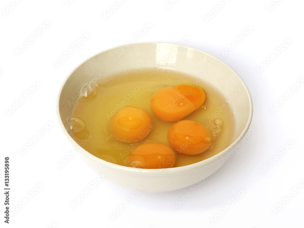 fresh eggs in a bowl on a white background