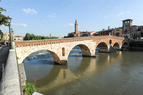 View to Bridge Ponte Pietra in Verona on Adige river © fotoember