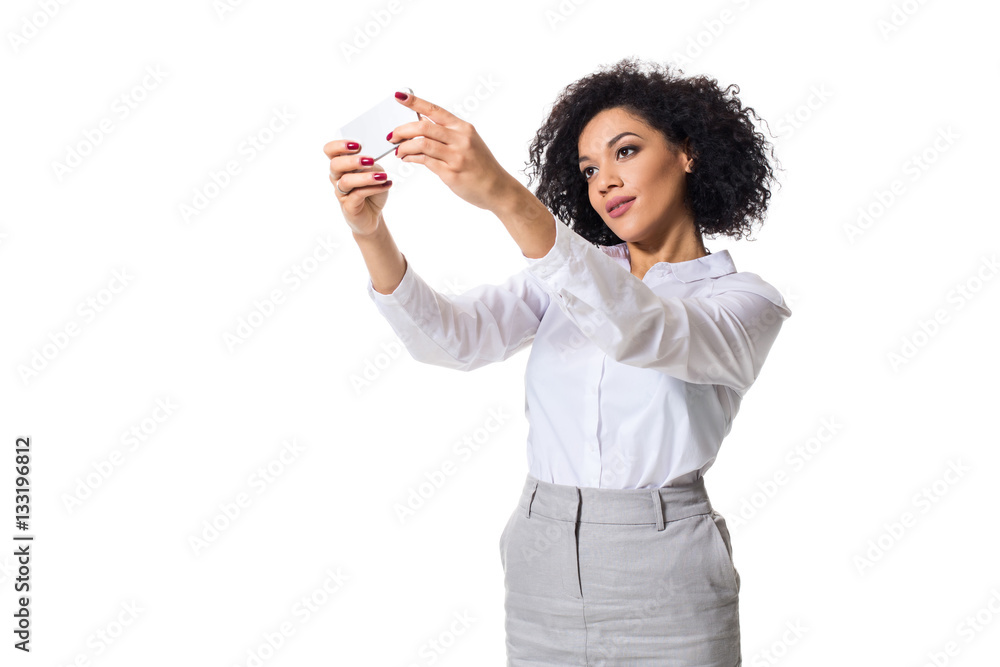 Beautiful brunette woman in classic white shirt and skirt make selfie on the phone. Beautiful brunette woman in classic white shirt and skirt make selfie on the phone.
