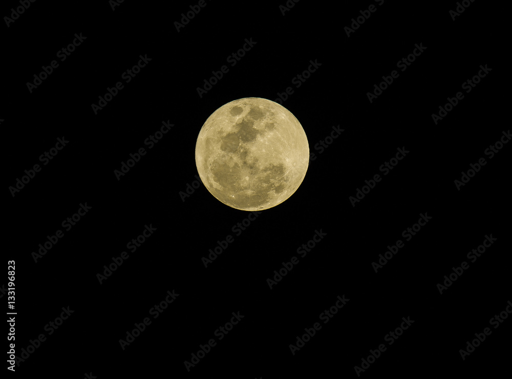 Full moon and radius over dark black sky at night Full moon and radius over dark black sky at night