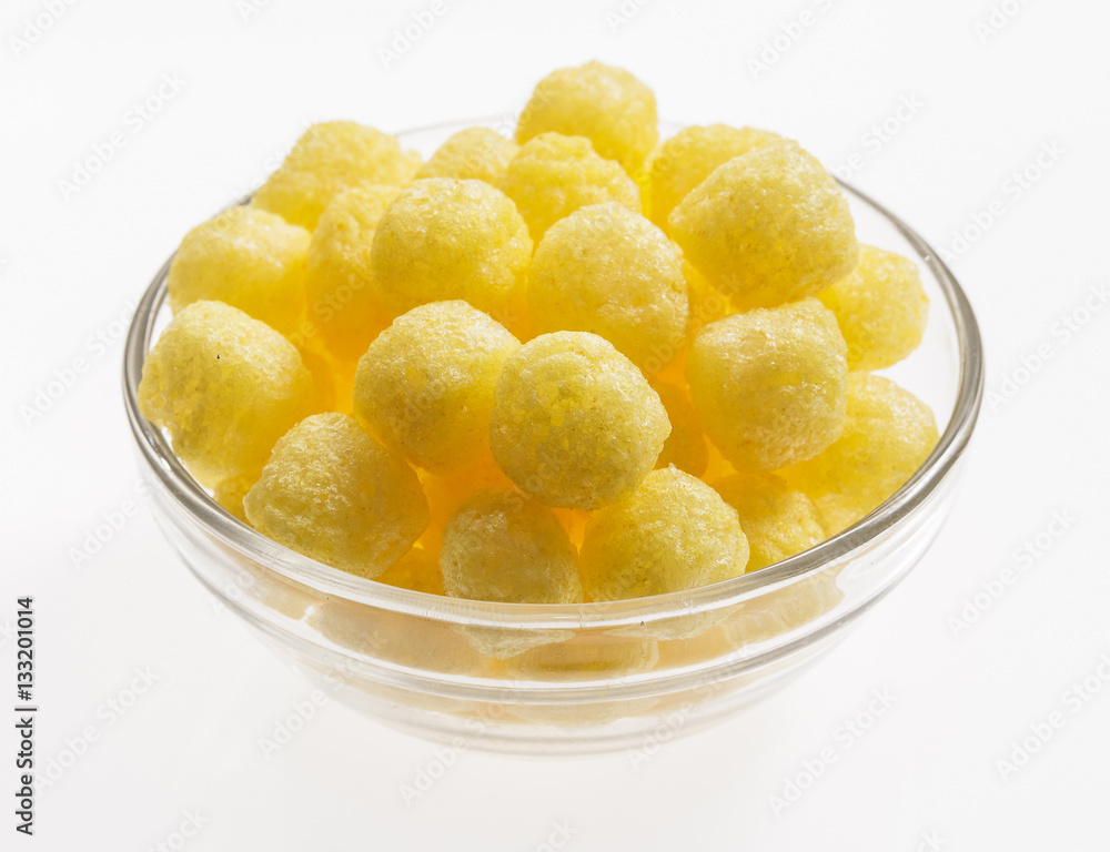 Snacks in a glass dish on a white background. Snacks in a glass dish on a white background.