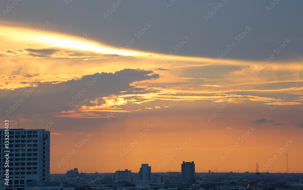 Sunset and clouds background in the evening, city downtown with sunset sky