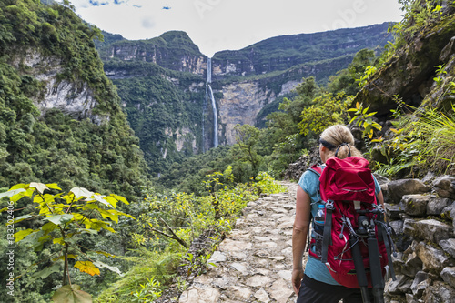 Peru, Amazonas Region, Cocachimba, tourist on hiking trail looking at Gocta waterfall photo
