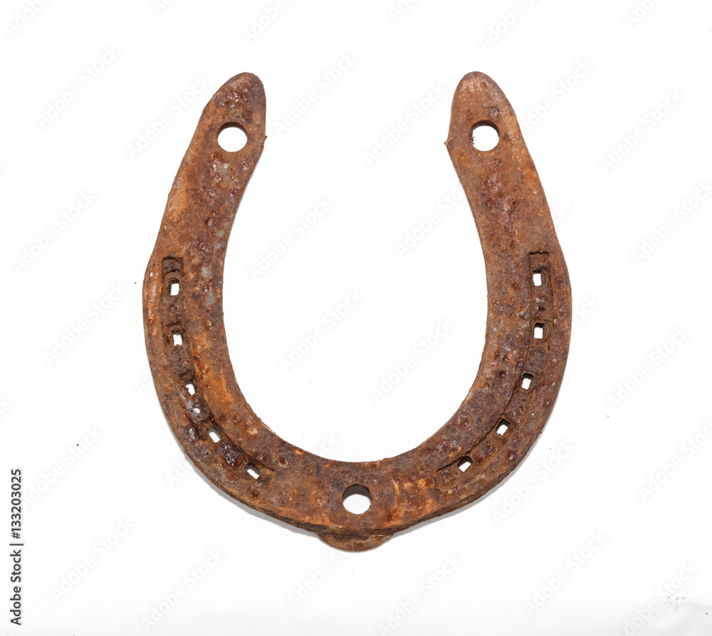 Rusty horseshoe on a white background. Rusty horseshoe on a white background.