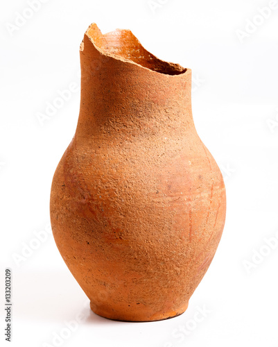 The broken clay jug on a white background.