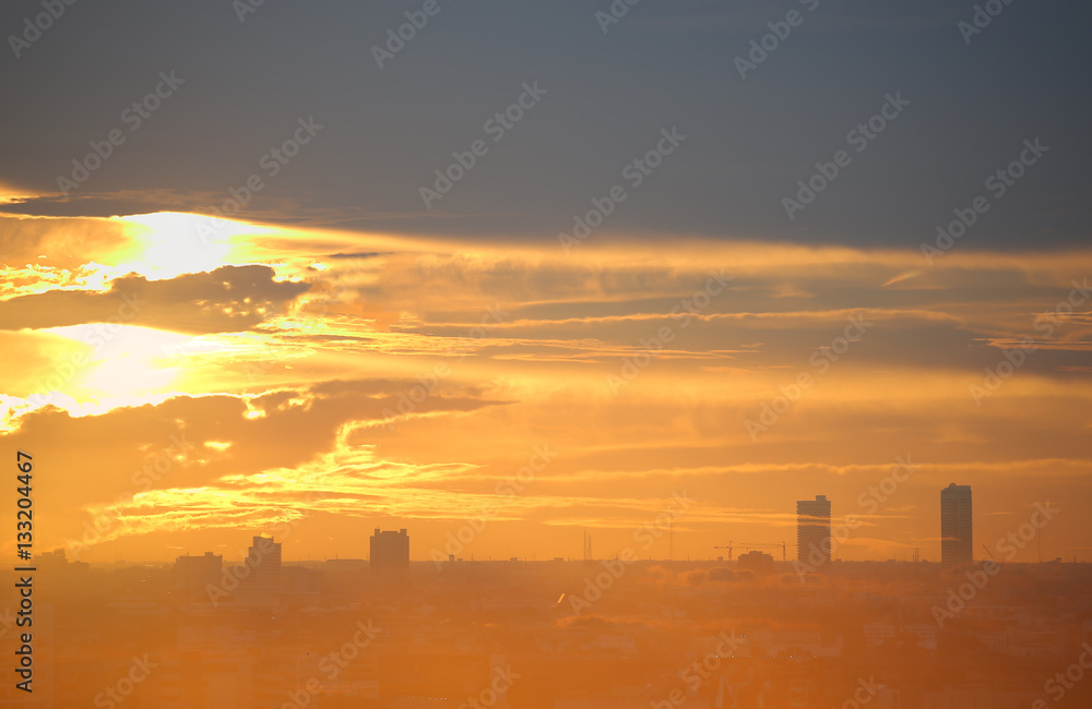 Sunset and clouds background in the evening, city downtown with sunset sky