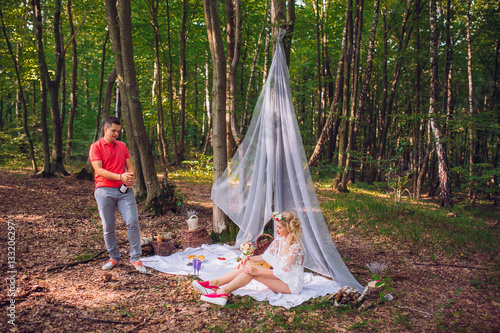 Portrait of cute couple drinking wine on picnic