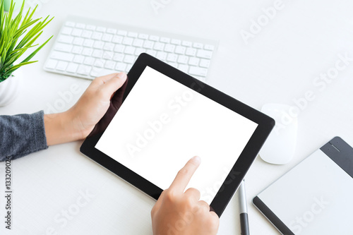hand using digital tablet finger touch blank screen on desk work