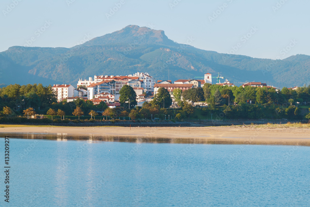 Fototapeta premium seascape. Bay with blue water on the background of the city of Hendaye. the French part of the Basque country