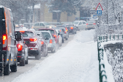 Traffic jam in the middle of winter. Snow calamity.