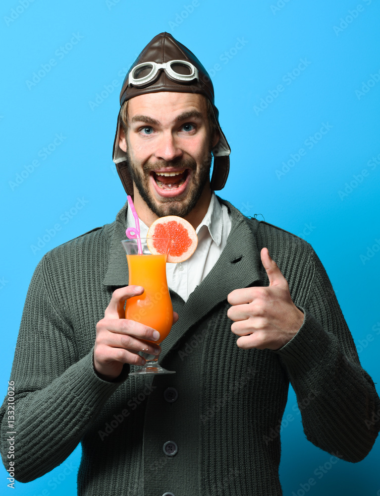 Fototapeta premium bearded pilot with cocktail in glass