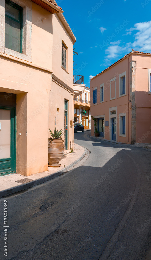 Pink buildings and road in Crete village