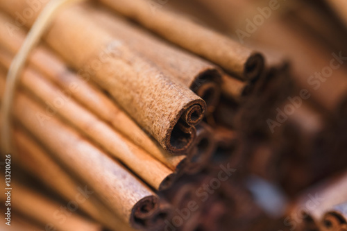 Cinnamon sticks seasoning. An aromatic spice made from the peeled, dried, and rolled bark of a Southeast Asian tree. photo