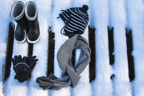 Winter gear laying on snow photo