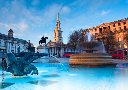London, fountains on Trafalgar Square early in the evening photo
