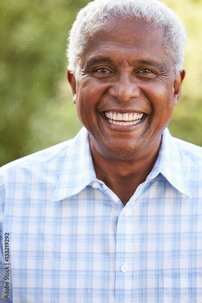 Portrait of smiling senior African American man, vertical Portrait of smiling senior African American man, vertical