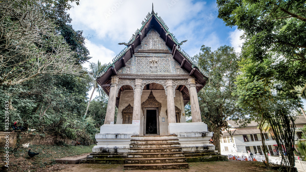 Luang Prabang, Laos - December 3, 2015: Buddhist temple in luang prabang, laos Luang Prabang, Laos - December 3, 2015: Buddhist temple in luang prabang, laos