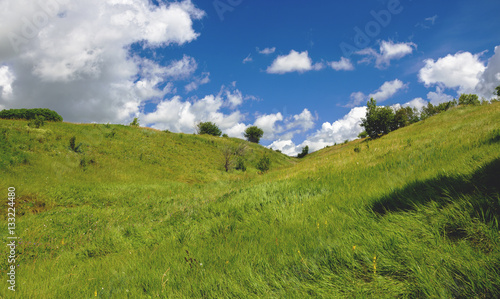 Blue sky over the green hills
