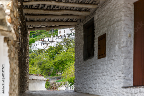 Fototapeta Naklejka Na Ścianę i Meble -  View of the bottom of a street, in a village of La Alpujarra, Gr