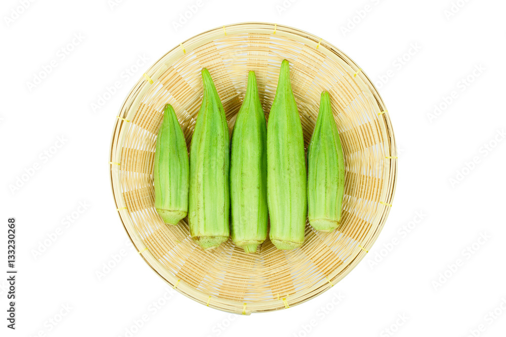 Fresh young okra in .Bamboo Basket isolated on white background Fresh young okra in .Bamboo Basket isolated on white background