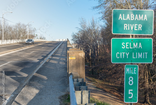 Green highway sign at the Edmund Pettus Bridge for Selma, Alabama