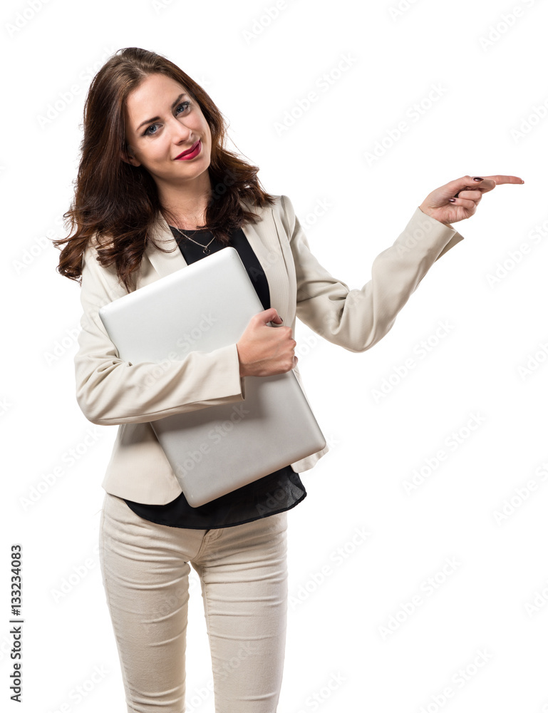 Pretty young business woman with laptop and pointing to the lat Pretty young business woman with laptop and pointing to the lat