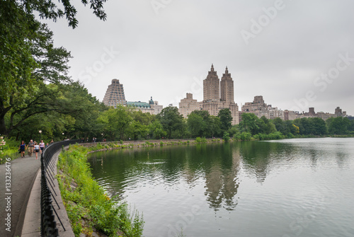 Twin towers reflecting in Central Park lake