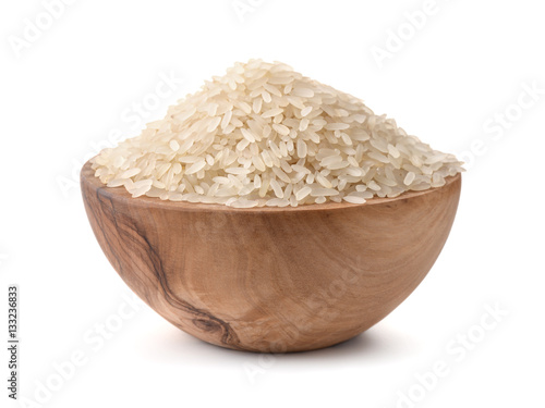  Uncooked dry rice in wooden bowl
