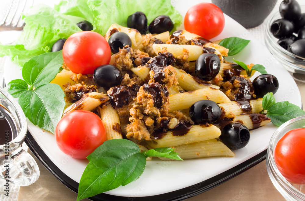 Pasta with bolognese sauce, beef meat, olives and cherry Pasta with bolognese sauce, beef meat, olives and cherry