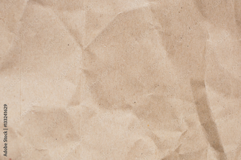 Fototapeta premium Recycled crumpled light brown paper texture or paper background