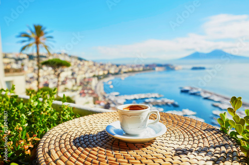 Fototapeta Naklejka Na Ścianę i Meble -  Cup of coffee with view on Vesuvius mount in Naples