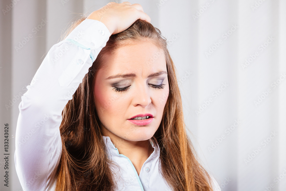 Stressed young woman pulling hair. Stressed young woman pulling hair.