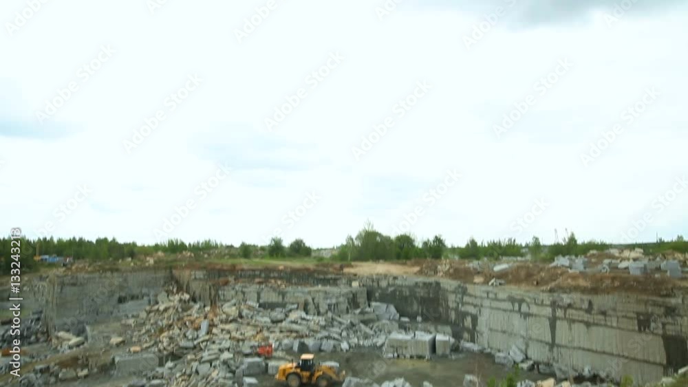 Quarry mining granite open-cast. Vertical pan