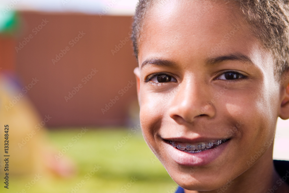 Happy African American boy with open arms. Happy African American boy with open arms.