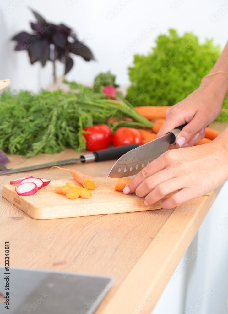 Fresh vegetables on the cutting board are falling in the pot, concept of cooking Fresh vegetables on the cutting board are falling in the pot, concept of cooking