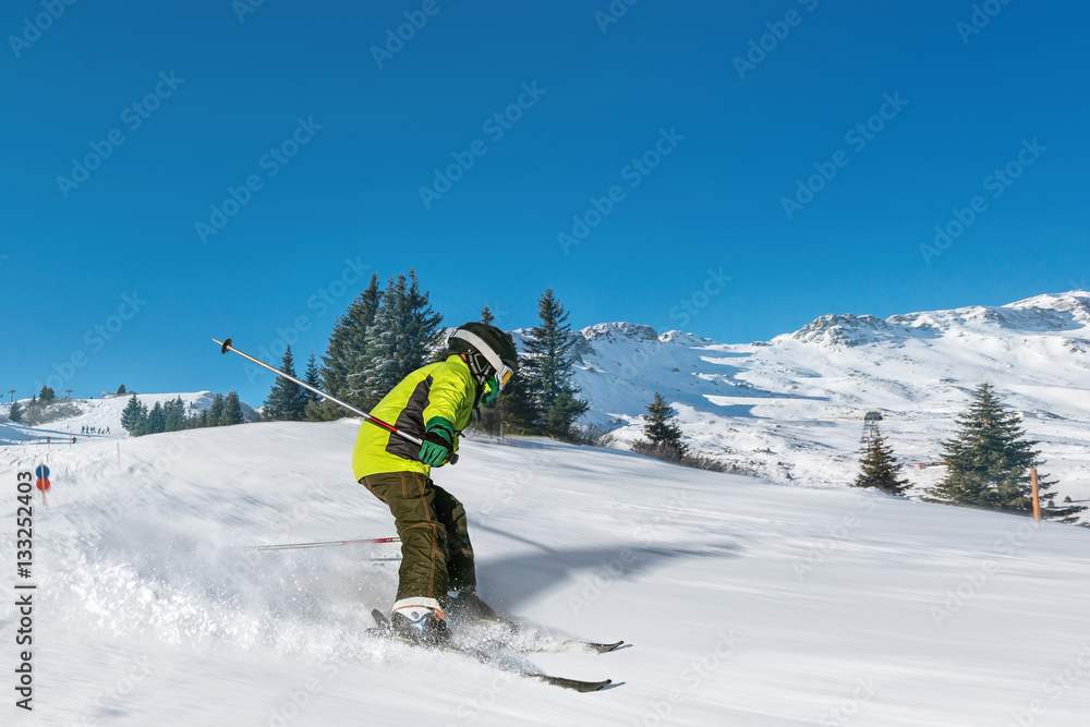 boy skiing fast in alpes