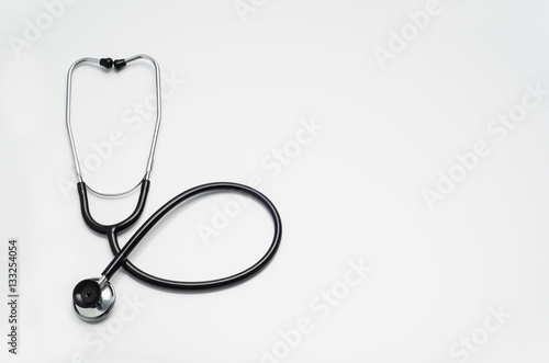 Top view of modern, sterile doctors office desk. Medical accessories on a white table background with copy space around products. Photo taken from above.