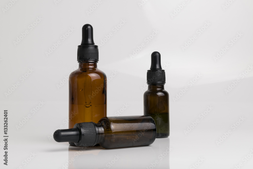 isolated drop glass bottle in brown color. isolated drop glass bottle in brown color.